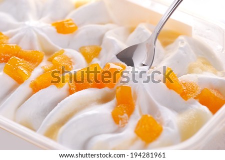 yogurt ice cream with pieces of peach