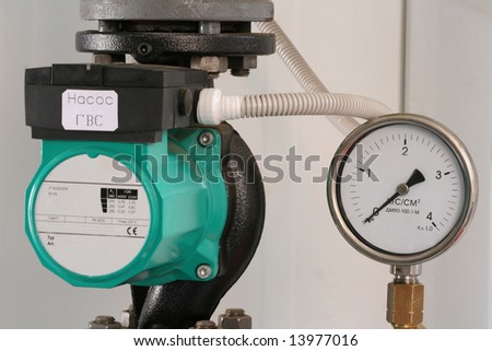 The pump and manometer - separate details in an interior of boiler-house