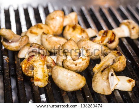 Cooking mushrooms on the grill in the restaurant