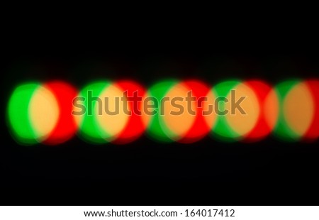 colored circles on a dark background bokeh