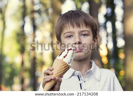 little boy eating an ice cream