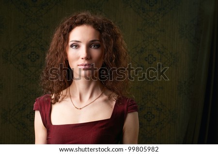 portrait of  beautiful woman on wallpaper background