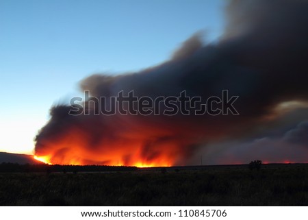 Flames and smoke column Castrocontrigo wildfire, Leon, started August 19, 2012