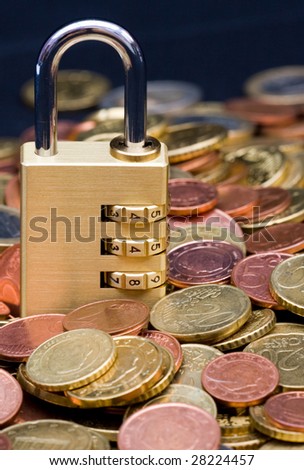 financial security , padlock on coins
