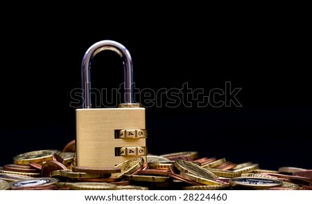 financial security , padlock on coins