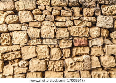 irregular natural stone wall (textured background)