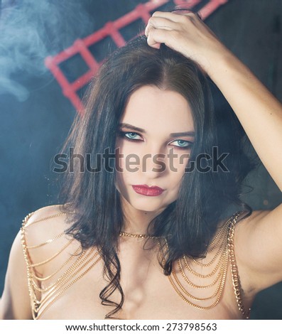 Young beautiful woman with chains
