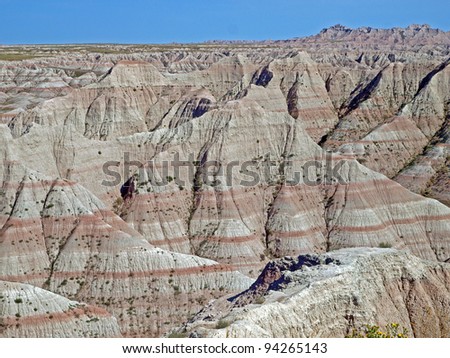 Iron oxide rich banding in the rock in the Badlands National Park, South Dakota