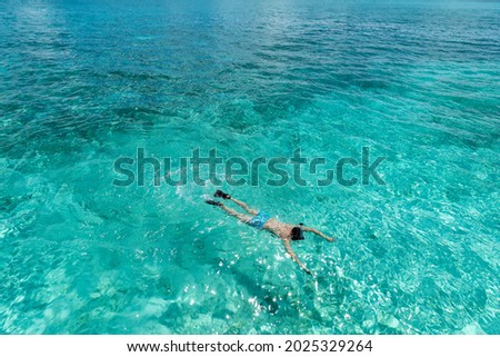 Similar – Image, Stock Photo Young man with snorkel and diving mask swimming and taking a selfie under water. Travel, vacation and sports activity concept.