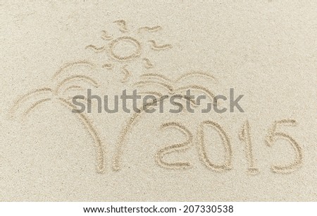 new year 2015 message on the sand beach