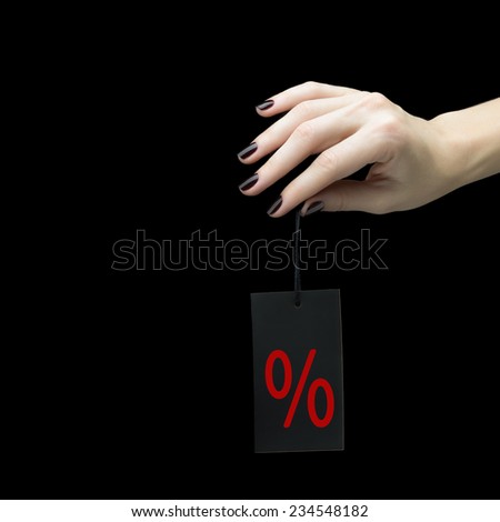 Sale Tag on women hand with percent sign