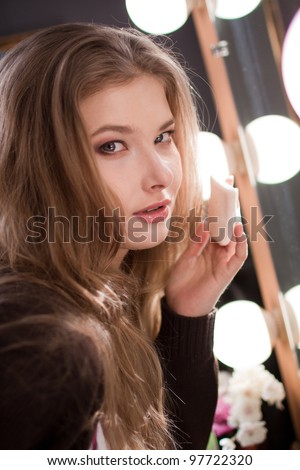 fashion model makeup on the mirror