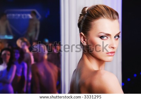 pretty woman in nightclub, different kinds of lighting, shallow DOF