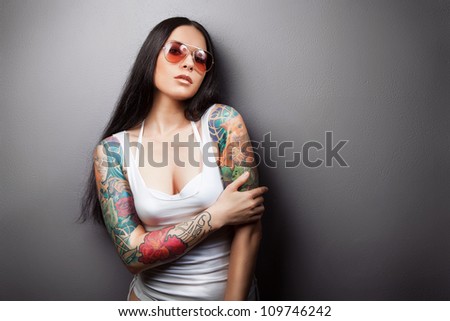pretty young girl with tattoo. lovely woman.