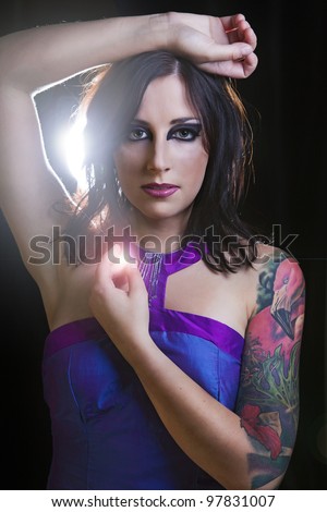Portrait of young beautiful brunette with stylish  tattoo. art.