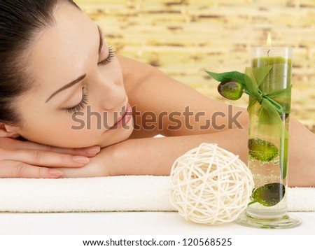 Relaxing white woman at beauty spa salon. Recreation therapy. Resting female with closed eyes