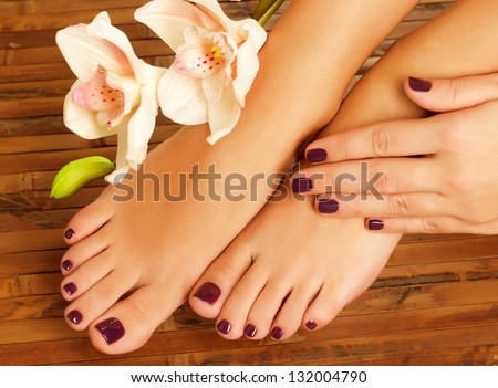 Closeup photo of a female feet at spa salon on pedicure procedure - Soft focus image