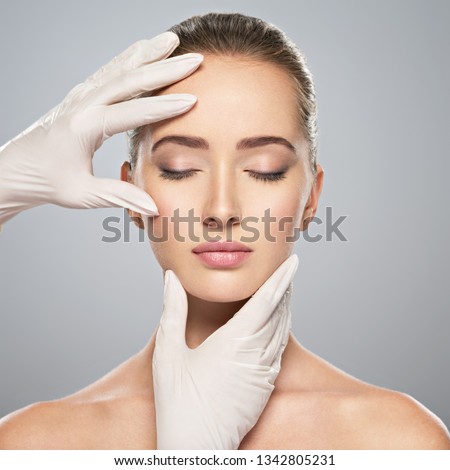 Similar – Image, Stock Photo woman with gloves touching her mask