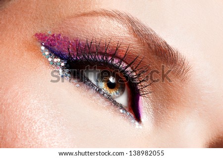 Closeup woman eyes with beautiful  fashion bright pink make-up