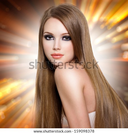 Sexy young woman with beautiful long straight  hair and attractive face