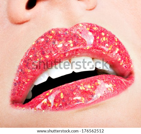 Closeup beautiful female lips with shiny red gloss lipstick