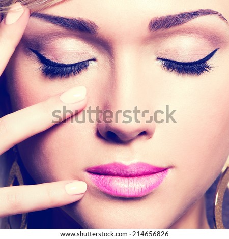 Closeup  pretty face of a caucasian woman with black eyelashes