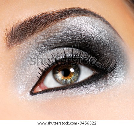 Fashion Image of woman eye with ceremonial make-up