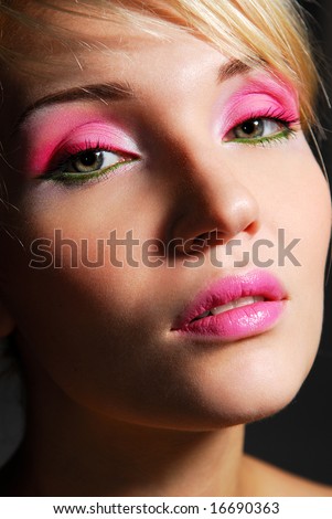 Face of beauty girl with bright pink ceremonial make-up