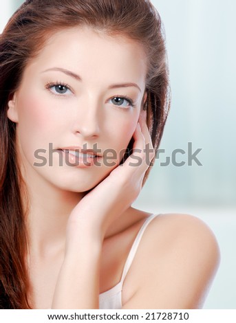 Natural health beauty  of a woman face - colored background