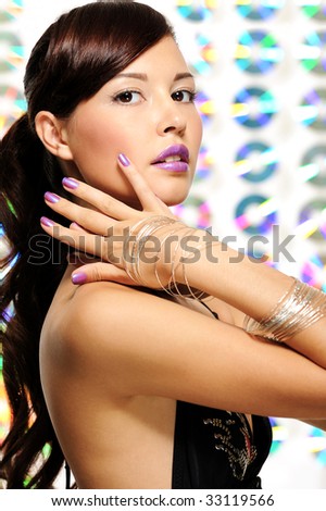 beautiful expressive young girl with violet lipstick and violet nail varnish