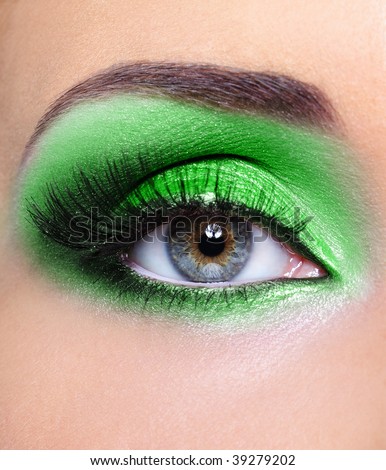 Fashion make-up of woman eye with green eyeshadows