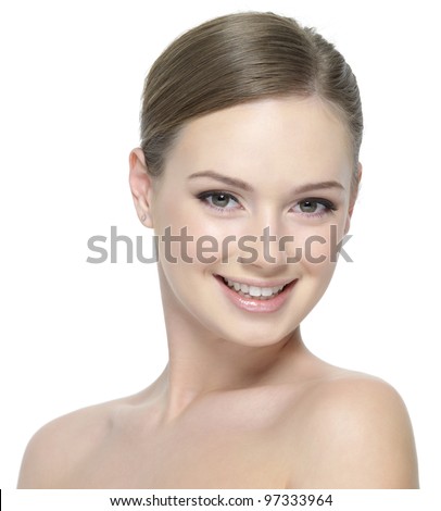Happy smiling face of young beautiful teen girl with clean skin - isolated on white