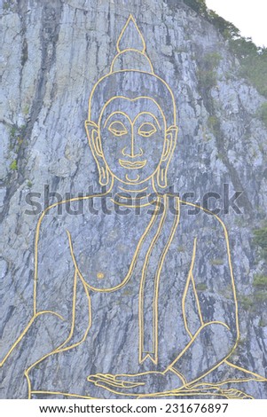 Buddha picture on the cliff made by laser near Pattaya, Thailand