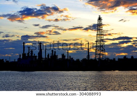 Oil refinery factory over sunrise Bangkok Thailand,Oil refinery with silhouette
