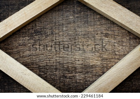 wooden stick on all four sides of the old wooden background