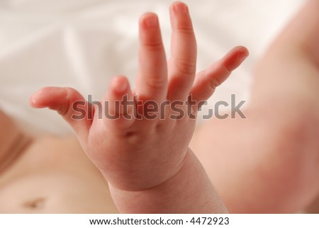 cute baby hand reaching up