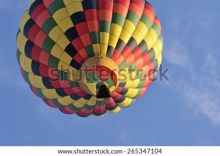 A hot air balloon in the sky a sunny day
