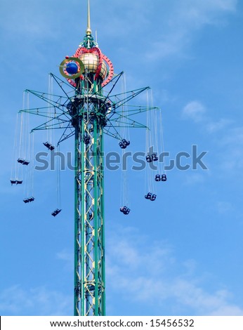 fairground ride in copenhagens tivoli set against a blue summer sky
