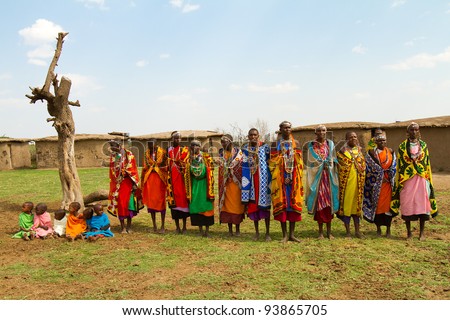 MASAI MARA, KENYA - AUGUST 24: A group of kenyan women of Masai tribe sings a traditional song to welcome their visitors on August 24, 2011 in a local village near Masai Mara National Park, Kenya.