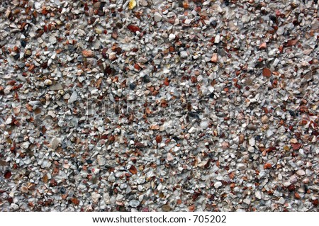 Pebble dash coating on a concrete rendered wall.