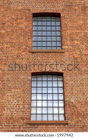 Windows in a dockside warehouse in Liverpool, Merseyside, UK.