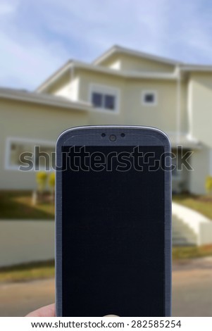 Smatrphone and house. Idea for smartphone home security system, monitoring system, real state applications, contractor, architecture, home improvements,  and others.