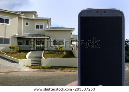 Smatrphone and house. Idea for smartphone home security system, monitoring system, real state applications, contractor, architecture, home improvements,  and others.