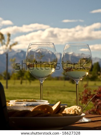Wine, cheese and crackers ready for relaxing afternoon in Wanaka, New Zealand