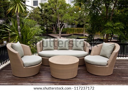 Luxury lifestyle sofa and green pillows in the garden