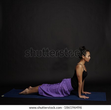 Asian young beautiful yoga posing on a black studio background-Studio Shooting.