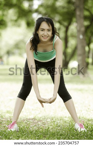 Fitness asian girl doing stretch exercise yoga stretches after running-Beautiful happy smiling sport fitness