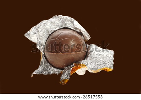 Easter chocolate egg, opened in gold foil