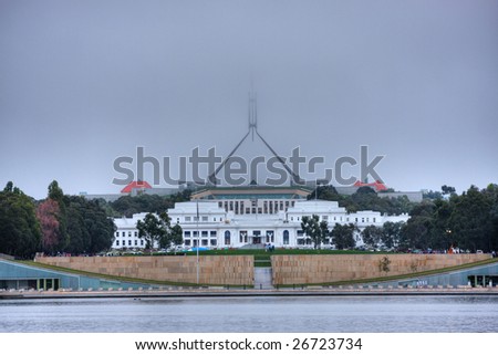 Australian Parliament house covered by morning fog