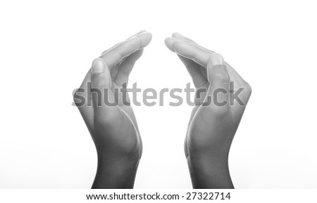 Hands clasped in religious prayer against white background